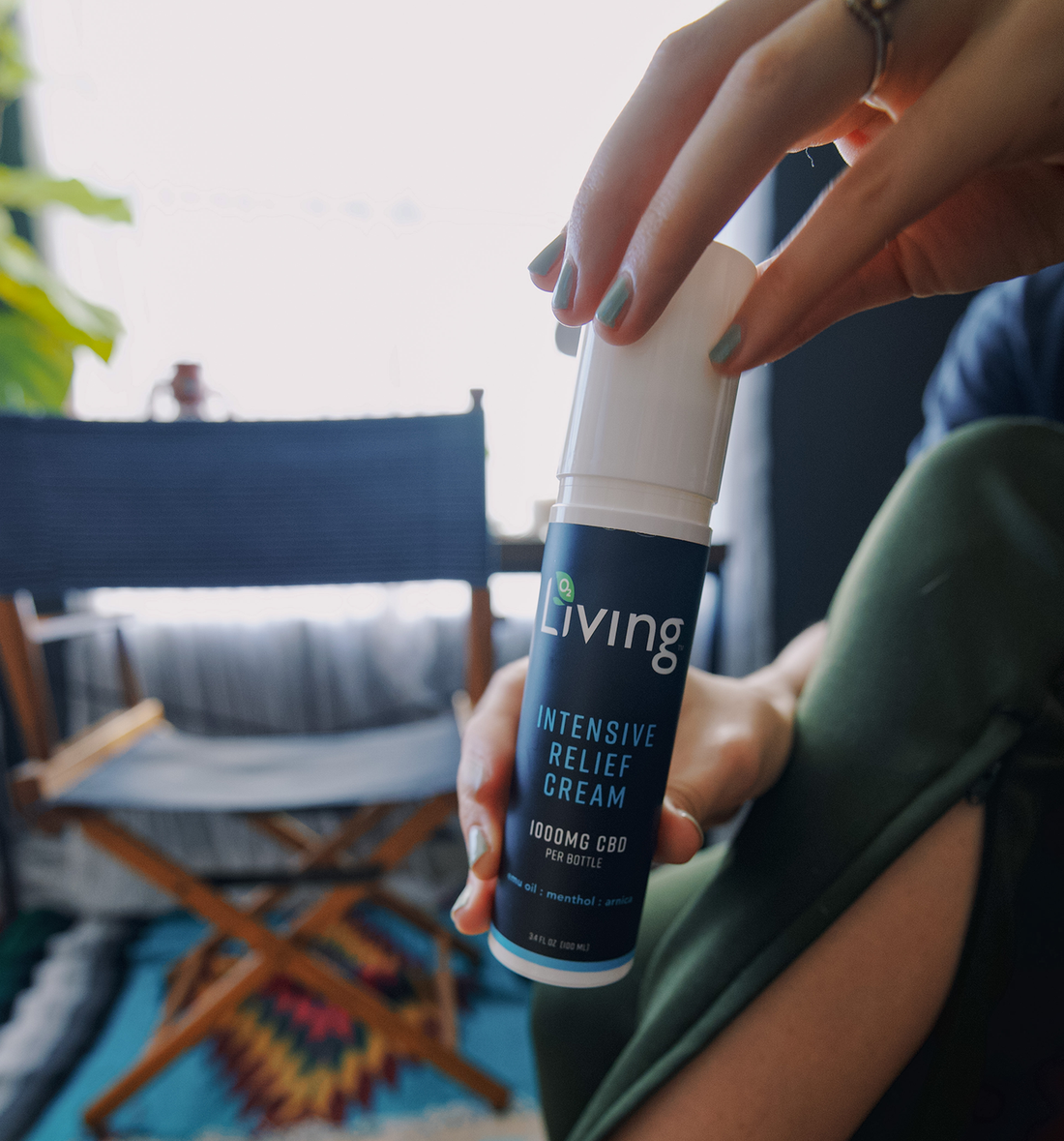 O2 Living Relief Rub Cream 1000mg CBD Pain Rub Woman Applying On Body